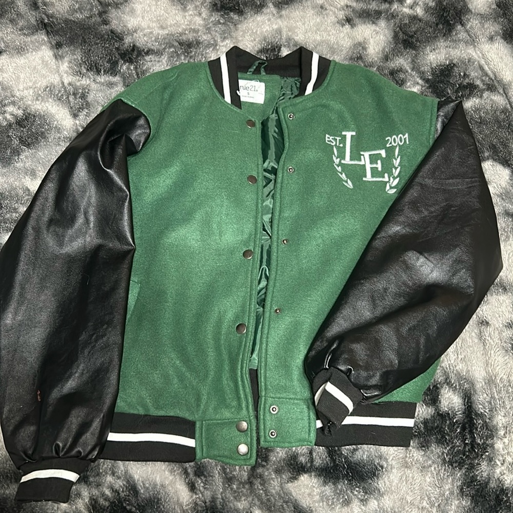 Green with black leather sleeves